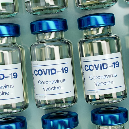 Fighting the Surge: Campuses Grapple with COVID Testing, Vaccine Protocols
